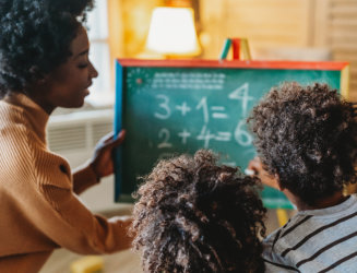 children learning maths with teacher