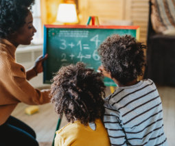 children learning maths with teacher
